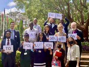 •	Photo: WEA Secretary General Bishop Dr Thomas Schirrmacher (middle row right) and WEA Sustainability Center Director Dr Matthias Boehning (middle row left) with a group of faith leaders at the UNEA-5 in Nairobi, Kenya © WEA