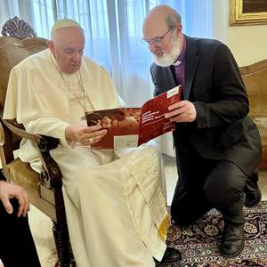 Photo: Bishop Thomas Schirrmacher discussing the new WEA brochure with Pope Francis when visiting the Pope when he fulfilled a decade in office © WEA/Schirrmacher