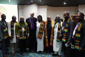 Photo: Thomas Schirrmacher with African delegates and the upcoming secretary of the Global Christian Forum, Casely Essamuah, and his wife Â© BQ/Warnecke